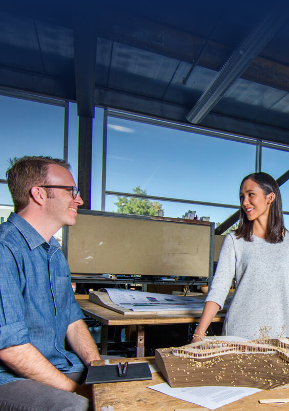 Arizona student and Researcher talking in the architect classroom